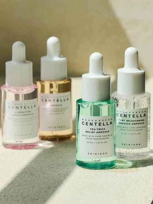 Four Centella serums in different colors targeting brightening, pores, acne and hydration