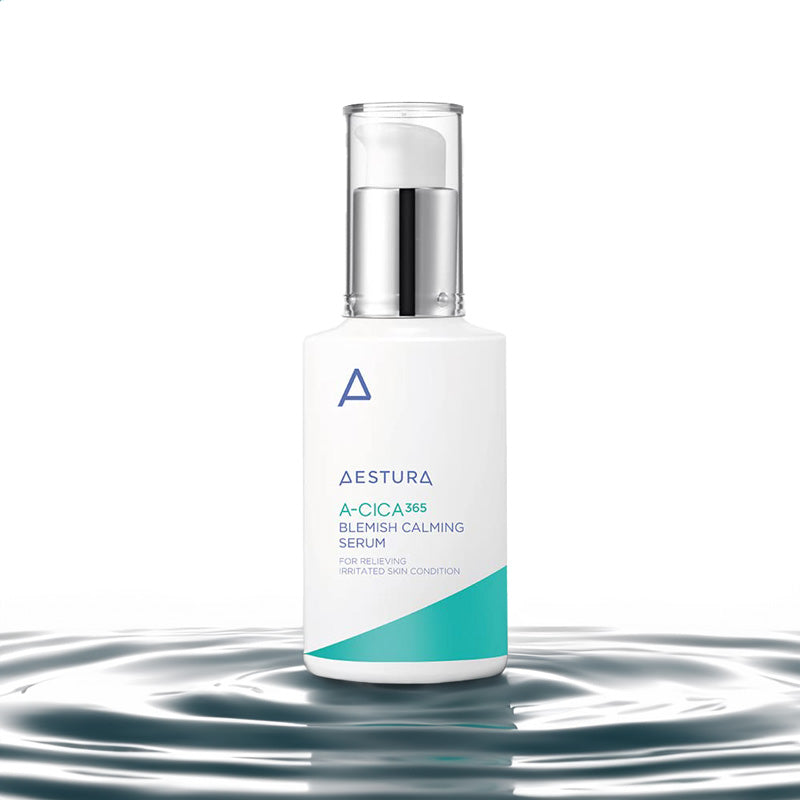 Aestura A-Cica 365 Blemish Calming Serum in a white pump bottle with a silver pump and clear cap, set against a white background with a water ripple effect at the bottom.