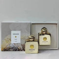 Amouage Gold perfume bottles with packaging on a light background