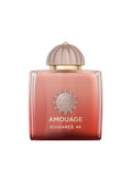 Amouage Guidance 46 perfume bottle with a square glass body showing a red-to-pink gradient, a metallic rose-gold cap, and gold lettering on a white background.