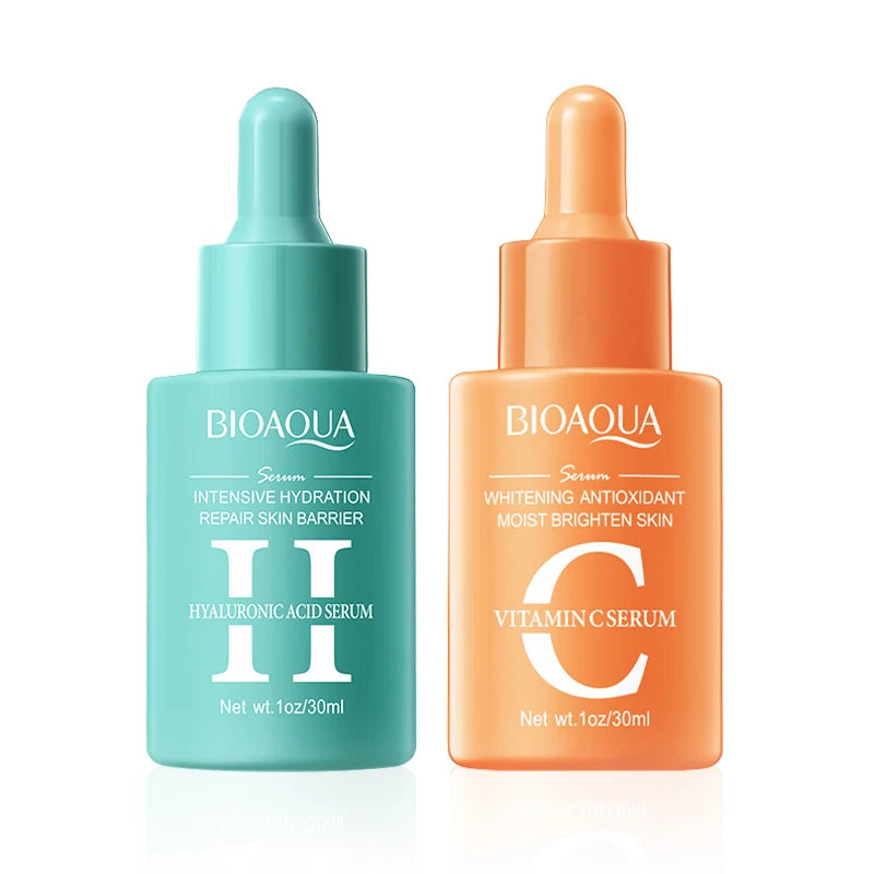 Two Bioaqua serum bottles, one green and one orange, on a white background.