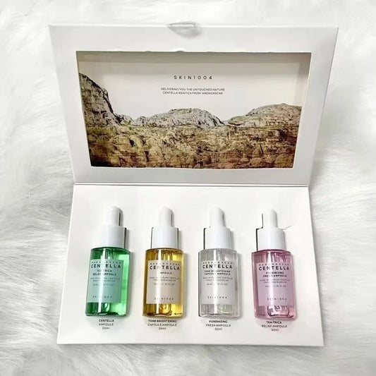 SKIN1004 Centella 4-serum set featuring white, pink, green and gold formulas for multi-action skincare