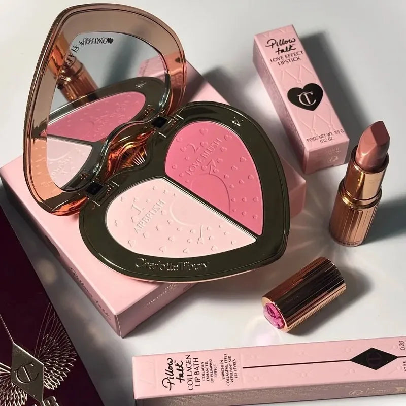 Makeup products including a blush palette, lip balm, and lipstick on a light background