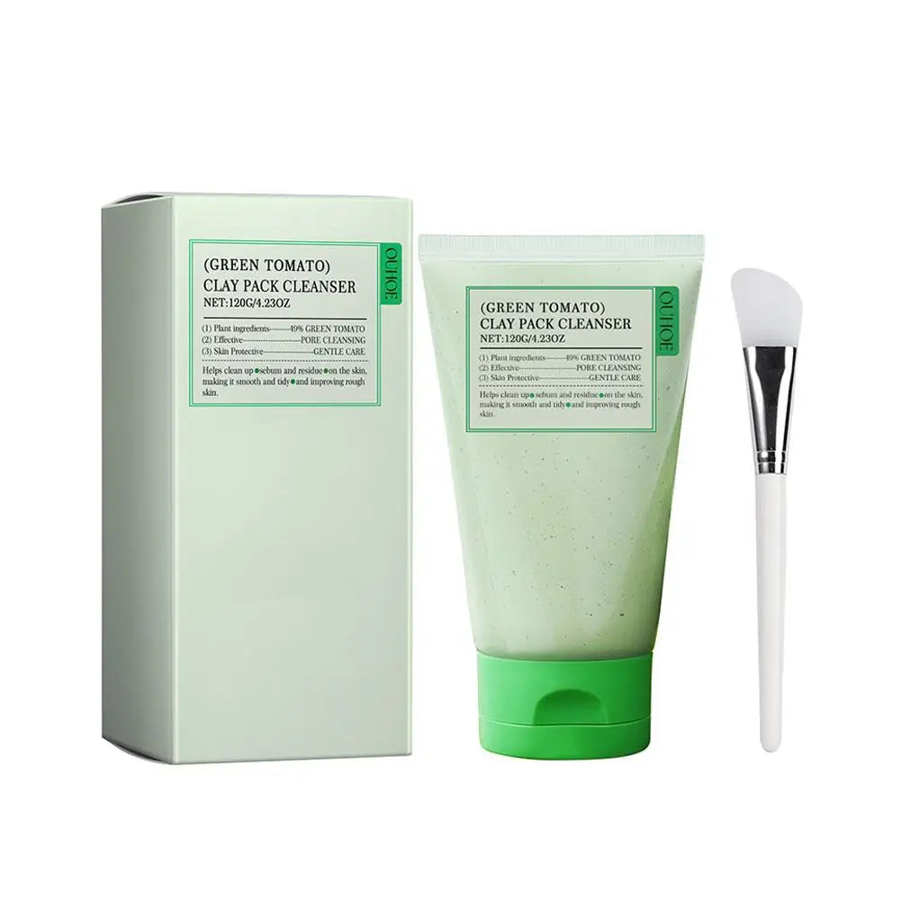 Green tomato clay pack cleanser with packaging and applicator on a white background
