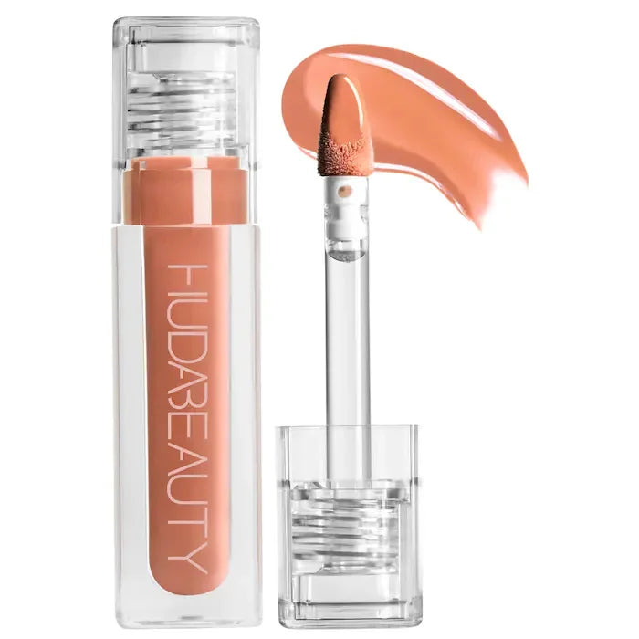Lip gloss with applicator and Huda Beauty branding on a white background