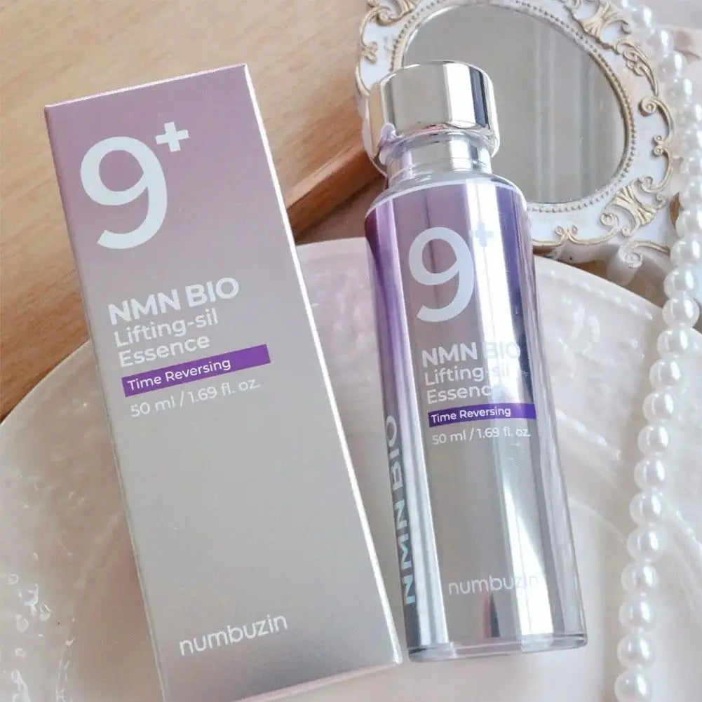 NMN BIO Lifting-sil Essence bottle and packaging on a decorative surface