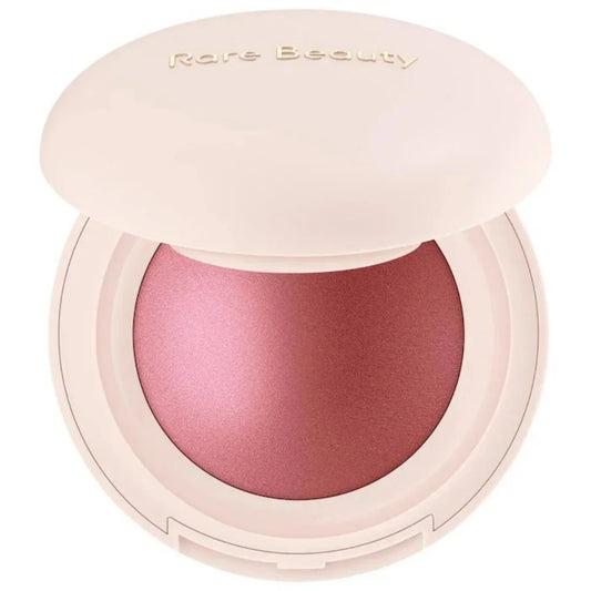 Pink blush compact with 'Rare Beauty' branding on a white background