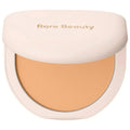Compact powder with 'Rare Beauty' branding on a white background