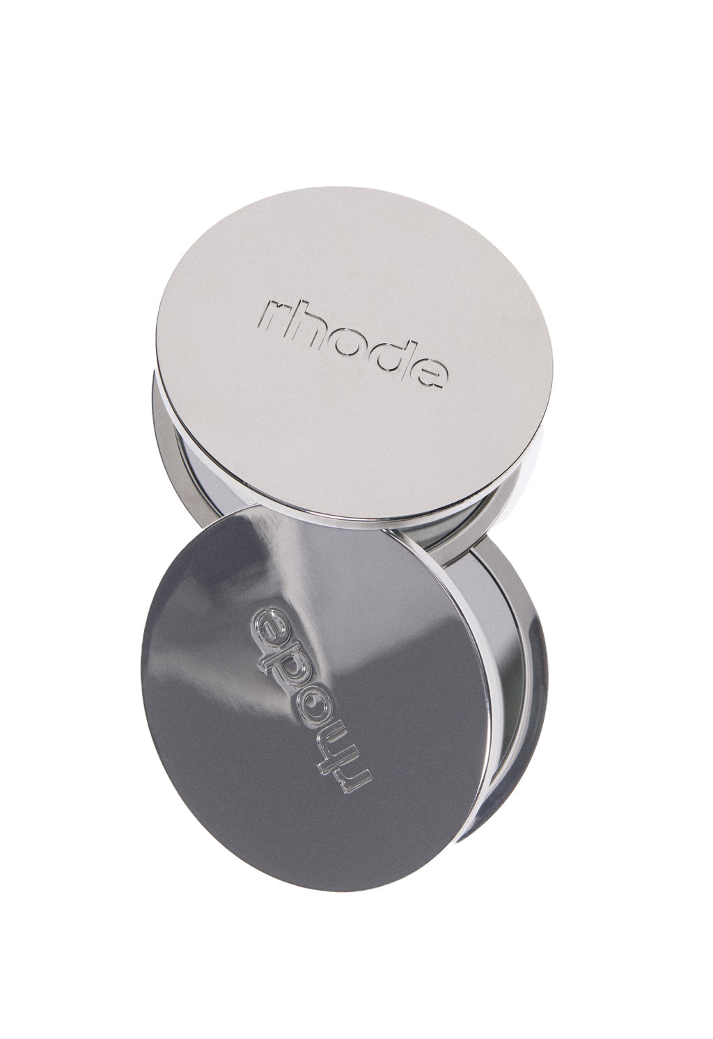 Silver round container with 'rhode' branding on a white background
