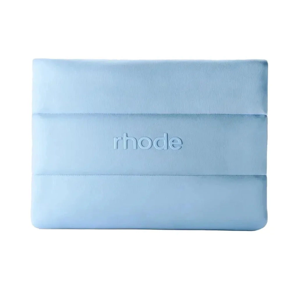 Light blue make up bag with 'rhode' branding on a white background