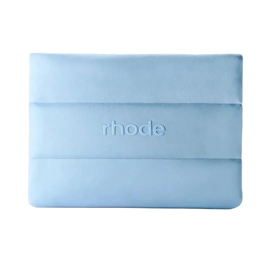 Light blue make up bag with 'rhode' branding on a white background