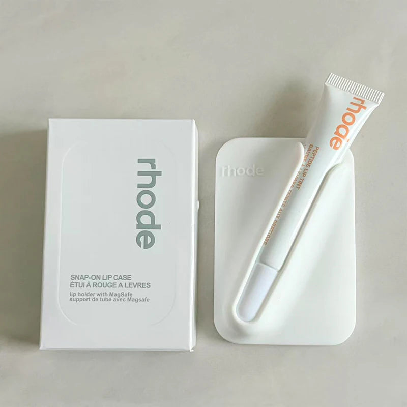 Cinnamon lip balm with 'rhode' branding next to a white box on a light gray background