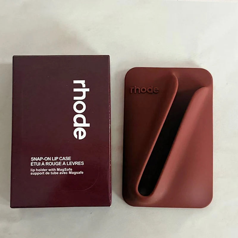 Brown lip case with 'rhode' branding next to its packaging on a light background