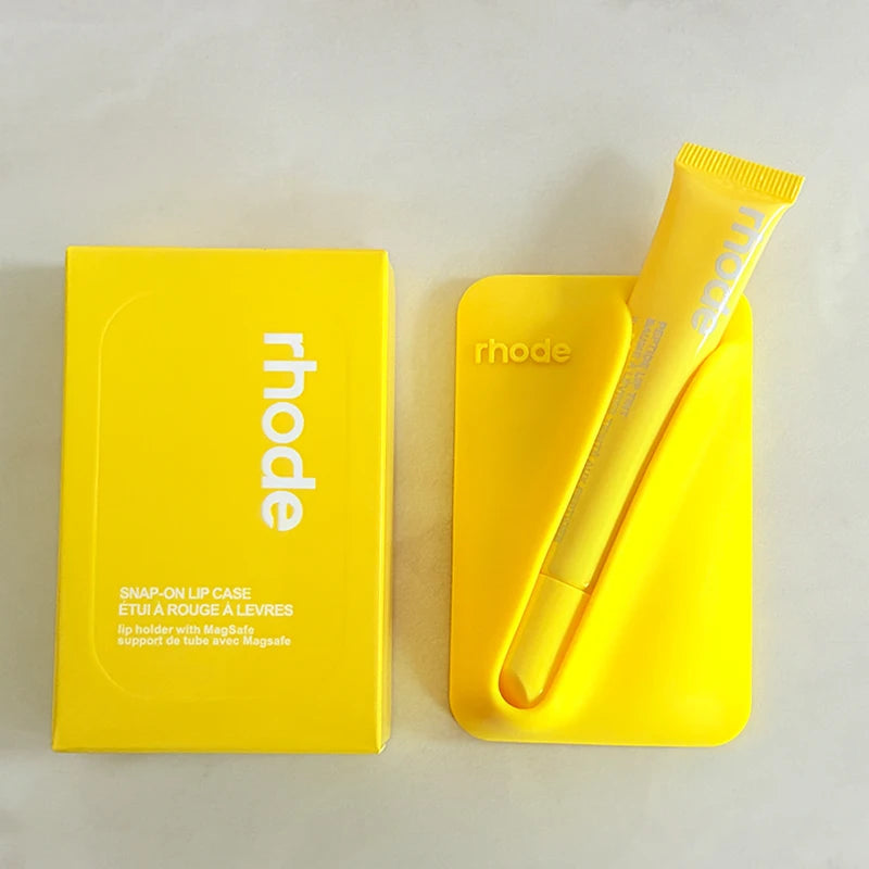 Yellow 'rhode' lip case and applicator on a light gray background