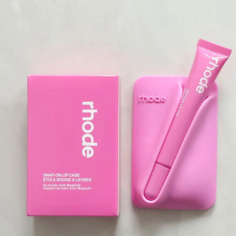 Pink lip case and packaging with 'rhode' branding on a light gray background