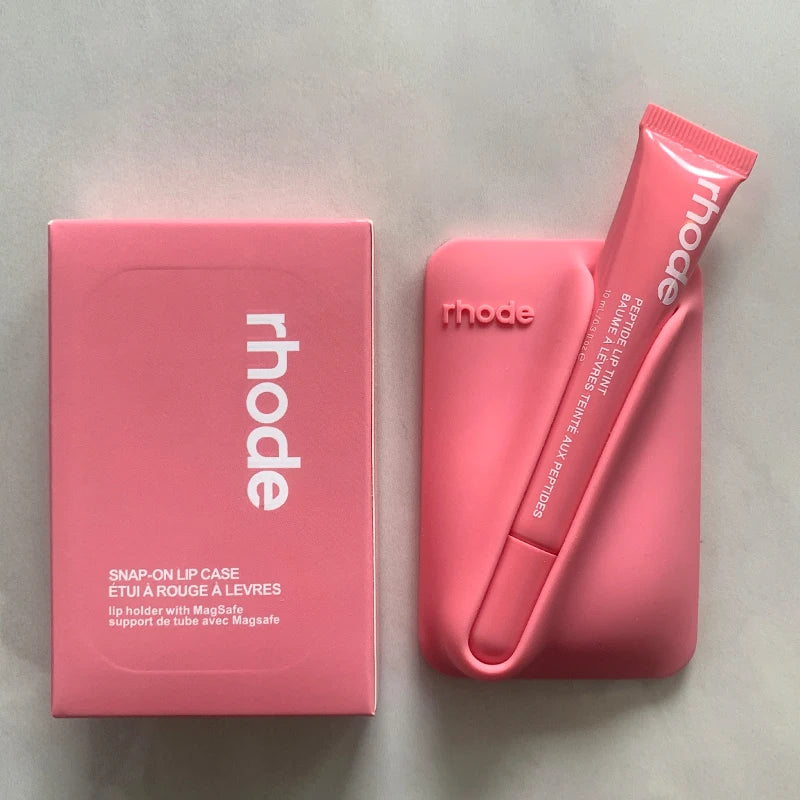 Pink 'rhode' lip case and packaging on a light gray background