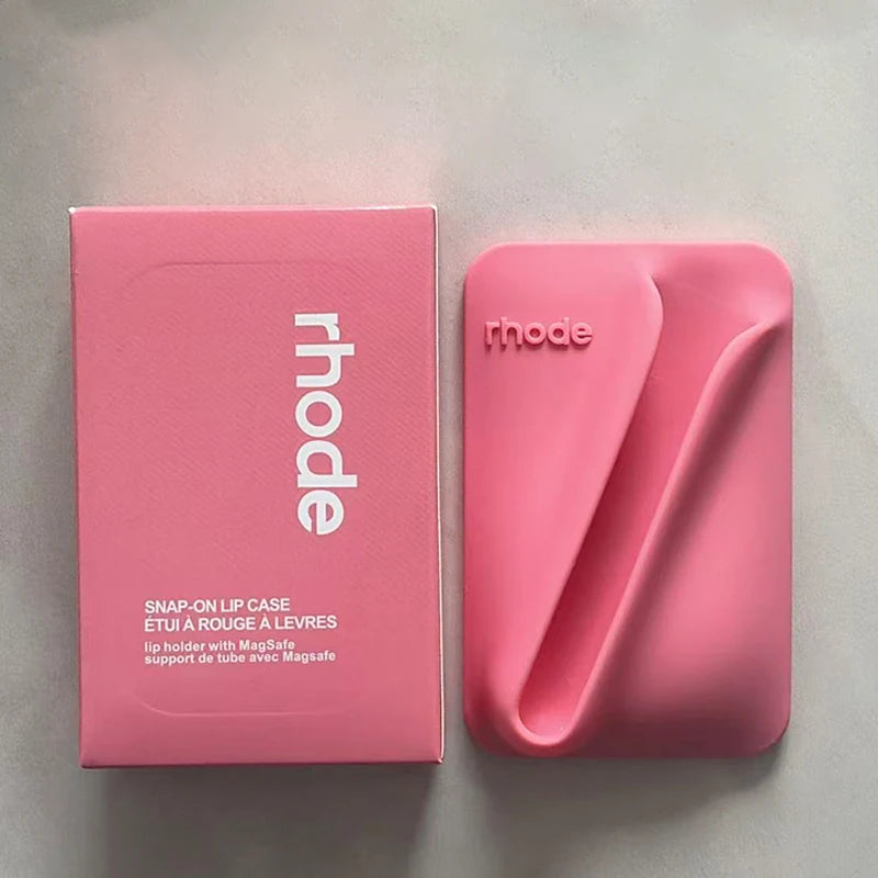 Pink lip case with packaging on a gray background
