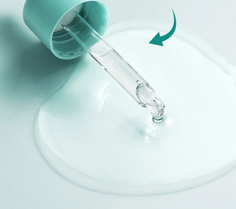 Glass dropper with a teal cap on a light blue background